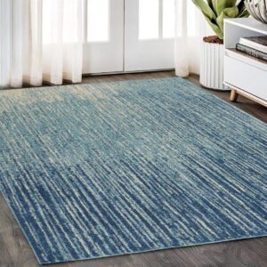 5' X 7' Blue And Ivory Abstract Area Rug