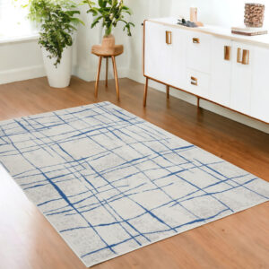 4' X 6' Ivory And Blue Geometric Distressed Area Rug