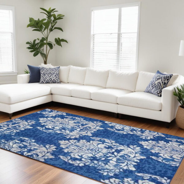 6' X 9' Blue And Ivory Floral Distressed Area Rug
