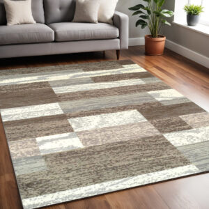 5' X 8' Light Blue And Ivory Patchwork Power Loom Stain Resistant Area Rug