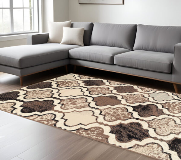 7' X 9' Ivory Quatrefoil Power Loom Distressed Stain Resistant Area Rug
