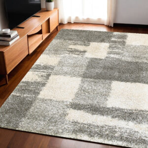 5' X 8' Gray And Ivory Abstract Geometric Shag Area Rug