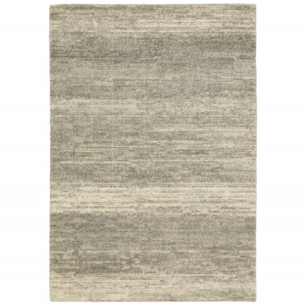 5' X 8' Grey Beige And Tan Abstract Power Loom Stain Resistant Area Rug