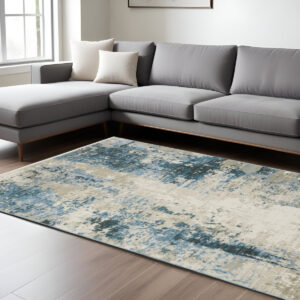 8' X 11' Blue Grey Ivory Light Blue And Dark Blue Abstract Power Loom Stain Resistant Area Rug With Fringe