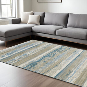 8' X 11' Ivory Beige Grey Blue And Tan Abstract Power Loom Stain Resistant Area Rug With Fringe