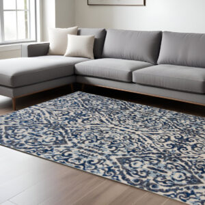 10' X 14' Blue Ivory And Black Floral Distressed Stain Resistant Area Rug