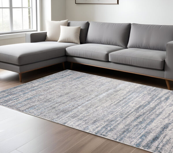 10' X 13' Blue Gray And Ivory Abstract Stain Resistant Area Rug