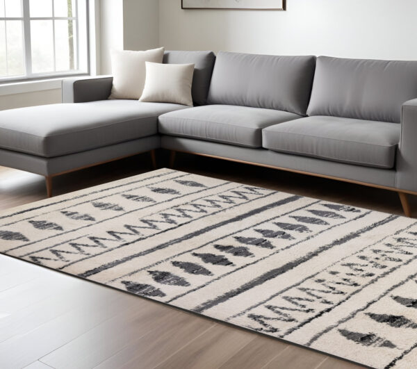 7' X 9' Black And Ivory Geometric Shag Area Rug