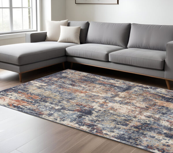 8' X 10' Ivory And Orange Abstract Area Rug