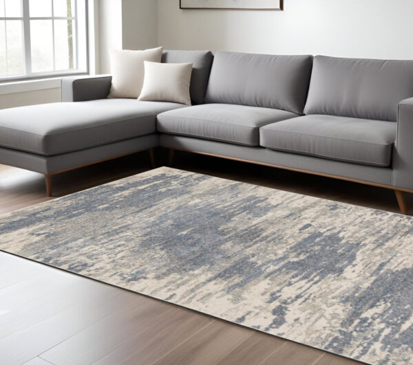 9' X 12' Ivory Blue And Gray Abstract Area Rug