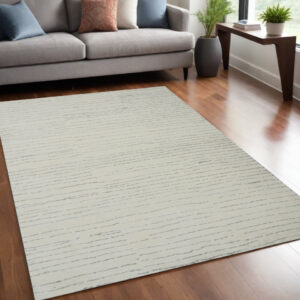 5' X 8' Beige and Gray Abstract Power Loom Distressed Non Skid Area Rug