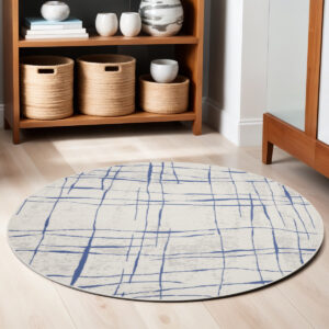 5' Ivory and Blue Abstract Geometric Distressed Round Rug