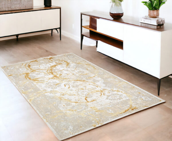 4' X 6' Beige and Gold Abstract Area Rug