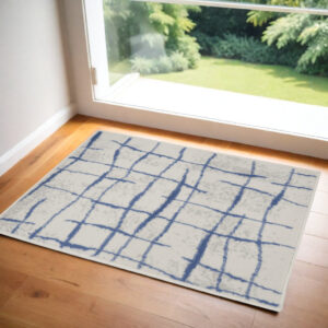 2' X 3' Ivory and Blue Abstract Distressed Area Rug