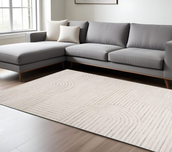8' X 11' Cream and Beige Abstract Area Rug
