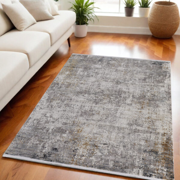 5' X 8' Ivory Taupe and Gray Abstract Power Loom Distressed Area Rug With Fringe