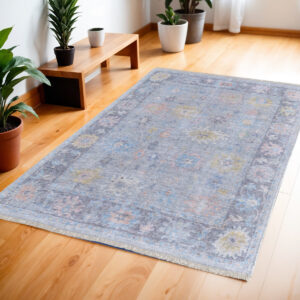4' X 6' Orange Blue and Gold Floral Hand Woven Distressed Area Rug With Fringe