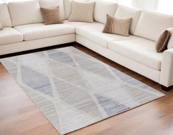 5' X 8' Ivory and Blue Geometric Hand Woven Area Rug