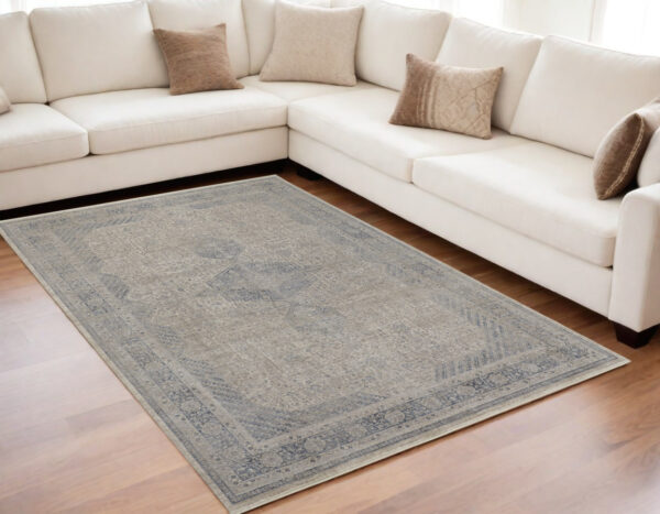 5' X 7' Gray Blue and Taupe Oriental Power Loom Worn Faded Area Rug With Fringe