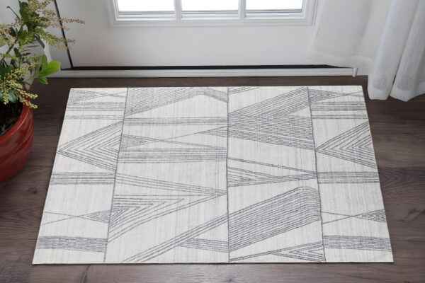 2' X 3' Black and Ivory Abstract Hand Woven Area Rug