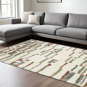 7' X 10' Tan Gray And Ivory Abstract Shag Distressed Area Rug With Fringe