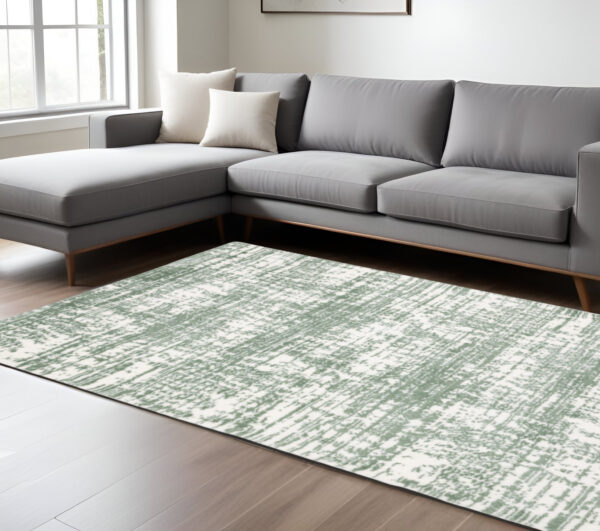 8' X 11' Green And Ivory Abstract Area Rug