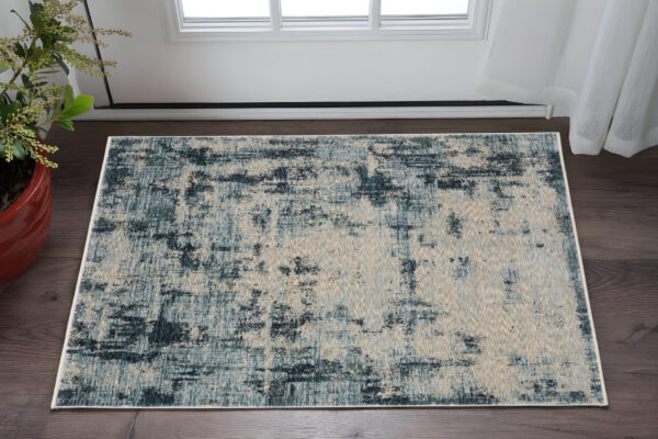 3' X 5' Beige And Blue Abstract Area Rug With Fringe