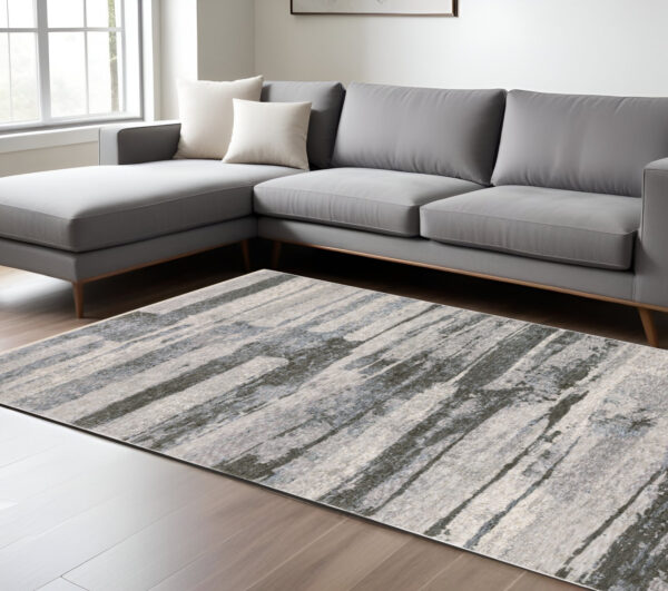7' X 10' Gray And Ivory Abstract Area Rug With Fringe