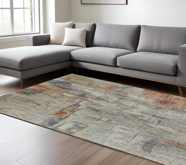 10' X 14' Gray Orange And Ivory Abstract Distressed Area Rug